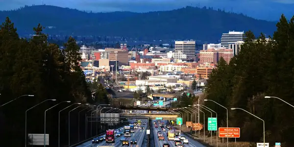 Spokane Web Design and Marketing inspired by the stunning nighttime skyline from I-90 approaching downtown Spokane.
